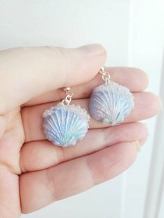 How pretty are these seashell earrings!?! light weight and comfortable!! A great unique gift for yourself or others! Hand sculpted blue pearl like iridescent seashell with clear bubbles! FREE GIFT WITH EVERY ORDER! Check out my other cute designs!! https://www.etsy.com/ca/listing/1266057299/pearl-mermaid-earringssea-shell https://www.etsy.com/ca/listing/1266078141/pastel-mermaid-earringssea-shell Ocean-inspired Shell Earrings With Ear Wire, Ocean-inspired Shell Earrings, Unique Shell-shaped Earrings For Gift, Unique Nickel-free Shell-shaped Earrings, Ocean-inspired Shell Earrings As Gift, Handmade Ocean-inspired Dangle Shell, Ocean-inspired Shell Dangle Earrings, Shell Ocean-inspired Earrings, Ocean-inspired Dangle Shell Earrings