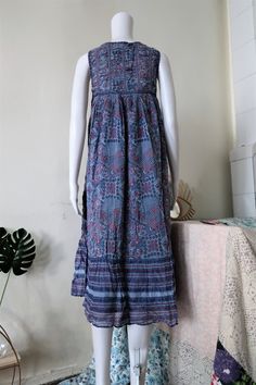 Beautiful True Vintage folklore dress from the 1970s or early 1980s. Midi length, comfortable light breezy cotton fabric with folklore print. A-line cut. Lined. Perfect for hot summer days. Made in India! ERA: 1970s, 1980s BRAND: Roshafi COLOUR: Different tones of blue, white, red FABRIC: 100% cotton SIZE: S - fits best size XS-S, please check the measurements below MEASUREMENTS: Pit to pit 39cm, total length 110cm CONDITION: Very good Vintage condition Folk Style Floral Print Maxi Dress, Bohemian Cotton Prairie Dress, Bohemian Cotton Prairie Dress For Spring, Spring Bohemian Cotton Prairie Dress, Bohemian Midi-length Prairie Dress, Bohemian Prairie Dress With Floral Print In Cotton, Bohemian Vintage Maxi Dress For Summer, Flowy Cotton Peasant Maxi Dress, Bohemian Patterned Dress With Vintage Print