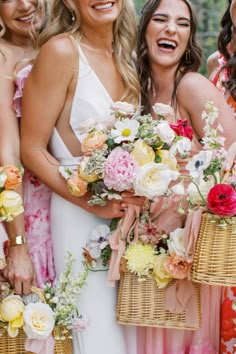 the bridesmaids are holding their bouquets and laughing for the camera photo credited