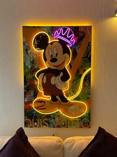 a mickey mouse neon sign in the corner of a room