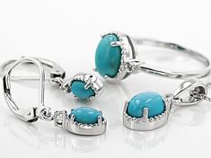 9x7mm oval, 8x6mm oval, and 6x4mm oval sleeping beauty turquoise with .16ctw round white topaz rhodium over sterling silver ring, pendant with 18" Singapore chain and earring set.  Ring measures approximately 3/8"L x 1/16"W.  Earrings measures approximately 1"L x 3/16"W and have a leverback closure.  Pendant measures approximately 3/4"L x 5/16"W.  3mm bail and lobster claw clasp closure with 2" extnder.  Not sizeable.  Rhodium plated Turquoise Oval Jewelry With Diamond Accents, Oval Turquoise Jewelry With Diamond Accents, Turquoise Sterling Silver Jewelry With Accent Stones, Fine Jewelry Turquoise Oval Cabochon, Fine Jewelry Oval Turquoise Jewelry, Fine Jewelry With Oval Turquoise, Fine Jewelry Oval Turquoise, Sterling Silver Jewelry With Oval Cabochon Gemstone Accents, Sterling Silver Jewelry With Gemstone Accents Oval Cabochon