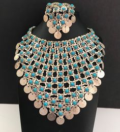 "ON SALE Very nice FAUX turquoise aqua blue beaded Silvertone metal large bib statement necklace and matching dangle drop brooch both are in very good vintage condition. Has a hook for a clasp on the necklace. Necklace measures 17 1/2 inches long and the big portion is 6 x 6\". The brooch is 3 inches long by 2 inches wide. A fun dramatic look perfect for any retro BoHo or any kind of outfit." Vintage Blue Choker Jewelry, Turquoise Costume Jewelry, Beaded Turquoise Metal Jewelry, Turquoise Beaded Metal Jewelry, Handmade Turquoise Metal Necklace, Nickel-free Turquoise Jewelry For Parties, Handmade Metal Turquoise Necklace, Metal Beaded Bib Necklace, Handmade Metal Bib Necklace In Costume Jewelry Style