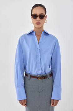 MODEL_1 Blue Button-up Top With Placket, Blue Unstructured Shirt With Button Closure, Light Blue Button-up Shirt With Button Cuffs, Oversized Light Blue Button-up Top, Luxury Light Blue Button-up Shirt, Frontal Closure, Wide Cuff, Engraved Logo, Poplin Fabric