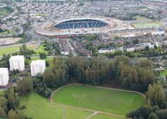 an aerial view of the olympic stadium in london, england with lots of trees surrounding it