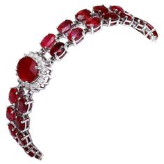 Very Impressive 23.30 Carats Natural Red Ruby & Diamond 14K Solid White Gold Bracelet STAMPED: 14K Total Natural Round Diamonds Weight: 1.30Carats (color G-H / Clarity VS2-SI1) Total Natural Rubies Weight is: 22.00 carats (Glass Filled) Bracelet length is: 7 inches Bracelet Width: 14.90mm (widest part) Bracelet total weight: 20.00g Disclaimer: all weights, measurements and colors are approximate and may vary slightly from the listed dimensions or as seen in the image. All pictures are magnified to show the smallest of details. Please, refer to the item description for actual weight and size evaluation. SKU #TF73 House Targaryen Aesthetic, Targaryen Aesthetic, Gold Armband, White Gold Bracelet, Ruby Diamond, Red Ruby, Natural Ruby, Bracelet Length, Natural Red