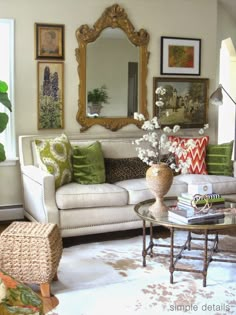 a living room filled with lots of furniture and flowers on top of a coffee table