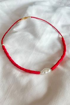 Basic Description: Handmade assorted red fimo beaded necklace. Very dainty. Necklaces are joined with a lobster-style clasp and two inch extended chain.  Sizing:  Each necklace is made with a two inch extender chain so the size can be adjusted to your liking. For example, the 16 inch necklace can be extended up to 18 inches. Care: While necklaces will not be damaged by moisture, avoid getting your necklace wet to prevent potential fading or tarnishing. Red Dainty Necklace With Colorful Beads, Dainty Red Necklace With Colorful Beads, Adjustable Red Necklace With Colorful Beads, Dainty Red Beaded Necklaces With Round Beads, Dainty Red Necklace With Lobster Clasp, Dainty Red Beaded Necklace With Round Beads, Red Adjustable Dainty Necklace, Red Dainty Adjustable Necklace, Adjustable Red Dainty Necklace