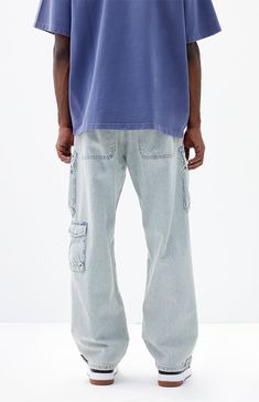 Step into comfort and utility with PacSun's Light Indigo Baggy Cargo Jeans. Crafted from rigid cotton, these jeans feature a wide leg and a light indigo wash. They offer plenty of storage with multiple cargo pockets and are finished with button tab at the hem, and a woven PacSun signature tag, combining practicality with signature style.


	Model is wearing size 32
	Model Measurements: 6'0” Height, 28" Waist, 34” Chest, 32” Hips Cargo Jeans, Baggy Fits, Exclusive Collection, Pacsun, Signature Style, Jeans Size, Mens Jeans, Mens Pants, Buy Online