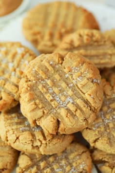 peanut butter cookies stacked on top of each other with powdered sugar in the middle