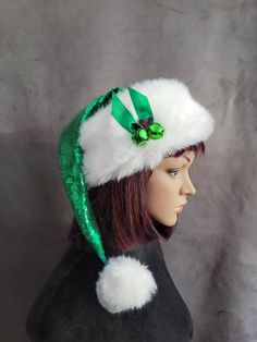 SIZING  These hats will fit average heads up to 22 inches.  These hats are made out of the prettiest, shiniest, Christmasy green sequins!! EVER I love this color, it is just so perfect for Christmas. The hats are lined with a minky fur in a soft minty color so it's soft on the inside and gives it a nice weight. The brims are a luxurious white faux mink fur, they are cut generously so they can be cuffed down. I only did a very small cuff in the photos because I liked this hat with a nice wide bri Adjustable Green Costume Hats And Headpieces As Gift, Adjustable Brimmed Hat For Holiday, Adjustable Green Hat For Gift, Adjustable Green Hat As A Gift, Adjustable Holiday Costume Hats, Adjustable Green Hats As Gifts, Adjustable Green Hat As Gift, Adjustable Christmas Cap, Adjustable Green Winter Hats