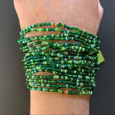 Beautiful Multi-Strand World Of Good Beaded Bracelet. Predominately Shades Of Green, With A Few Tiny Pops Of Other Colors. The Beads Are Glass, And The Bracelet Is Handcrafted In Guatemala. Approximate Measurements Body Of Bracelet: 5 Inches Full Length End To End: 7.5 Inches Green Bracelets With Large Beads For Beach, Green Beaded Wrap Bracelet For Festival, Green Wrap Bracelet With Round Beads For Festival, Green Wrap Bracelet With Round Beads For Beach, Green Hand-strung Wrap Bracelet For Beach, Hand-strung Green Wrap Bracelet For Beach, Green Bead Bracelet For Festivals, Green Beaded Friendship Bracelets For Festivals, Green Wrap Bracelet With Colorful Beads