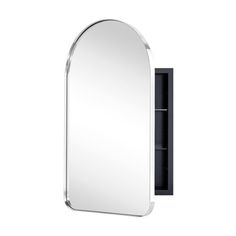 an oval mirror mounted on the wall next to a shelf with a cabinet underneath it