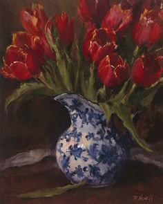 a painting of red tulips in a blue and white vase