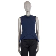 100% authentic Roland Mouret sleeveless structured top in navy blue wool (100%). Opens with a zipper on the back and is lined in black silk (26%), acetate (71%) and elastane (3%). Has been worn and is in excellent condition. Measurements Tag Size UK6 Size XXS Shoulder Width 37cm (14.4in) Bust From 84cm (32.8in) Waist From 68cm (26.5in) Length 55cm (21.5in) Side Seam Length 40cm (15.6in) All our listings include only the listed item unless otherwise specified in the description above Navy Modern Tops For Work, Modern Navy Tops For Work, Modern Sleeveless Top For Workwear, Modern Structured Formal Top, Elegant Tailored Structured Tops, Chic Tailored Tops For Night Out, Chic Structured Tailored Tops, Modern Sleeveless Formal Tops, Modern Sleeveless Tops For Formal Occasions