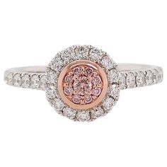 This beautiful ring is featured by Argyle Pink Diamonds and White Diamonds set in PT900 platinum and 18 Karat pink gold. It holds connotations of romance and would be a spectacular gift that can be worn with both daytime and evening looks. - Round Brilliant-Cut Argyle Pink Diamonds total 0.07 carat - Round Brilliant-Cut White Diamonds total 0.36 carat (color E-F, clarity VVS-VS) - Made of Platinum and 18K Pink Gold - Ring Size US6 (can be sized upon request) Argyle mine in Western Australia take Pink Gold Rings, Argyle Pink Diamonds, Pink Diamond Ring, Platinum Diamond Engagement Rings, Pink Diamonds, White Diamond Ring, Pink Morganite, Platinum Engagement Rings, White Gold Diamond Rings