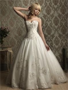 a woman in a wedding dress posing for the camera with her hand on her head