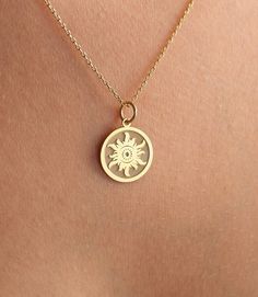 14K Real Solid Gold sun gold necklace ● Material of pendant: Solid Gold 14k ( REAL GOLD ) ● Metal Stamp: 14L ( REAL GOLD ) ● The pendant is available in 6 sizes: - 14,0 mm / 0,55 inches ( Diameter ) In the photos - 15,3 mm / 0.60 inches ( Diameter ) - 16,5 mm / 0,65 inches ( Diameter ) - 19,1 mm / 0,75 inches ( Diameter ) - 21 mm / 0,82 inches ( Diameter ) - 23 mm / 0.90 inches ( Diameter ) ( In the photos the size is 14mm / 0.55 inches Diameter ) ( Jump Ring inner diameter: 4 mm ) ● Material Of Dainty Yellow Gold Medallion Jewelry, Celestial 14k Gold Round Pendant Jewelry, 14k Yellow Gold Medallion Charm Necklace, Symbolic 14k Gold Pendant Charm Necklace, Celestial 14k Gold Medallion Jewelry, Celestial Style 14k White Gold Necklace, Celestial Yellow Gold Jewelry With Charms, Celestial Style Yellow Gold Jewelry With Charms, Celestial Sun And Moon Yellow Gold Jewelry