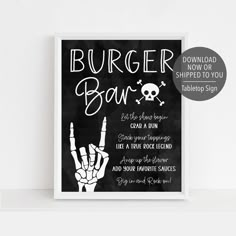 a chalkboard sign with the words burger bar written on it and a hand holding up two fingers