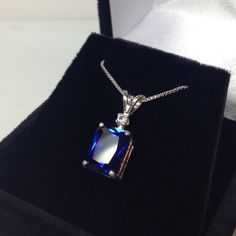 "Beautiful Blue & White Sapphire Pendant Necklace * 4ct Emerald Cut Blue Sapphire measures 10mm x 8mm * Brilliant Cut White Sapphire Accent measures 2.5mm * 4.1cts total gemstone weight * 14k White or Yellow Gold * 18\" Sterling Silver link Chain Included Hallmarked & Gift Ready! Matching Earrings & Ring Also Available! This 4ct Sapphire is Laboratory Grown & is identical to natural in every way, including Chemistry, Composition & Hardness with Excellent Clarity & Color R Blue Sapphire Pendant For Men, Formal Emerald-cut Solitaire Necklace In Cubic Zirconia, Formal Emerald Cut Solitaire Necklace With Cubic Zirconia, Classic Sapphire Diamond Necklace With Brilliant Cut, Exquisite Formal Gemstone Pendant, Sapphire Diamond Necklace For Formal Occasions, Formal Sapphire Diamond Necklace In Fine Jewelry Style, Exquisite Pendant Gemstones For Formal Occasions, Classic Sapphire Diamond Necklace For Formal Occasions