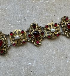 Circa 1800s Beautiful Austro Hungarian Garnet Pearl Gold Sterling Silver Victorian Art Nouveau Antique Bracelet Stunning, Highest of quality Measures 7 inches in length a little over 1 inch wide See  matching necklace in link below  https://www.etsy.com/listing/1682435990/victorian-art-nouveau-austro-hungarian?click_key=4aeb6d2f3fbad4f596876f572e4685baa536afbf%3A1682435990&click_sum=5615c927&ga_search_query=Austro&ref=shop_items_search_58&pro=1&frs=1&sts=1 Vintage Baroque Jewelry With Historical Design, Vintage Ceremonial Jewelry With Historical Design, Ceremonial Vintage Jewelry With Historical Design, Antique Red Bracelet For Formal Occasions, Red Antique Bracelet For Formal Occasions, Victorian Hallmarked Bracelets For Ceremonial Occasion, Victorian Gold Jewelry, Hungarian Jewelry, 1800s Jewelry