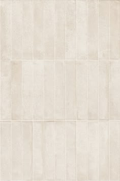 a white tile wall that is very clean and ready to be used as a background