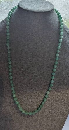 "Chinese Jade Bead Necklace * HALLMARKS Unmarked. * MEASUREMENTS 8mm beads with overall length of 28\". * WEIGHT 61.92 Grams *  MATERIALS Jade, silk cording. * CONDITION In very good to excellent condition, please use pictures as part of description. Art Deco Chinese Jade bead necklace. Beads are strung on hand knotted silk cord and this is the type of necklace with no clasp and it slips over the head. Necklace will arrive gift boxed. Thank you for stopping by!!" Luxury Jade Beaded Necklaces With Natural Stones, Luxury Jade Beaded Necklace With Gemstone Beads, Jade Emerald Necklace With Round Beads For Healing, Classic Jade Necklaces With Round Beads, Classic Jade Necklace With Round Beads, Single Strand Jade Beaded Necklace With Round Beads, Jade Beaded Necklaces With Round Beads, Green Beaded Necklaces With 8mm Round Beads, Round Green Beaded Necklaces With 8mm Beads