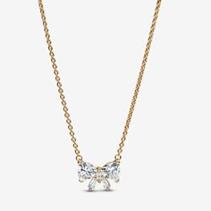 You're never fully dressed without a bow. But this time, that bow is made up of sparkling cubic zirconia, set in a 14k gold plated bow-shaped centrepiece, fixed to an adjustable chain. The stones have been especially cut to create a bow shape when arranged, ready to tie all your looks together. Wear this collier necklace for a touch of festive sparkle, or wrap it with love for the one who's top of your gift list. - Pandora Sparkling Bow Necklace - 14k Gold-plated unique metal blend / Cubic Zirco Pandora Bow Necklace, Necklace Pandora, Charms Disney, Pandora Essence, Custom Charm Bracelet, Heart Promise Rings, Custom Charm Necklaces, Pandora Necklace, Bracelet Tennis