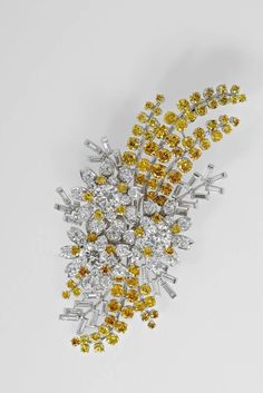 "Art deco Inspired CZ zircon yellow sapphire 925 sterling Silver Queen Elizabeth Australian Wattle Brooch\" for her/ wedding Metal: Sterling Silver Metal Purity: 925 Metal Wt:.15.59 Grams Stone:CZ zircon  Stone color: white White Stone weight: 3.98 Gemstone: yellow sapphire  Yellow stone weight: 3.20 cwt Stone Clarity:AAA+ Item Dimension:  Length: 2.5 inches Breadth: 1.00 inches  Product Color:18k white gold Plated on Sterling Silver" Fancy Brooch, Australian Wattle, Royal Jewellery, Royal Collection Trust, Reine Elizabeth, Isabel Ii, Wedding Brooch, Her Majesty The Queen, Royal Jewels