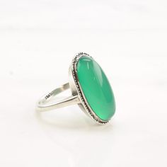 This ring is a size 9 1/2 (USA); It may be resized. Markings: Silver (Tested & guaranteed to be Sterling Silver) This ring weighs 5.7 Grams The Stone/Design is Green Chrysoprase Oval   Natural  The Stone/Design measures 22 x 10.8 mm The Ring face measures 24.5 x 13.5 mm The condition of this ring is Estate, Very good, light patina This vintage item is circa 1940  To have us do the resize, add this listing and the resize listing to your cart and select which size you would like this ring to be on the resize listing which may be accessed through this link: https://www.etsy.com/listing/780307949/simple-silver-ring-resize Stock# R4387Dor For more vintage sterling silver rings please visit:  https://www.etsy.com/shop/SilverStarrs925?section_id=13854217 Thank you for viewing my item!  Favorite t Oval Opal Ring For May Birthstone, Classic Oval Turquoise Ring For Formal Occasions, Classic Green Oval Opal Ring, Green Oval Opal Ring For Formal Occasions, Adjustable Oval Emerald Ring For Anniversary, Green Oval Rings With Large Stone, Oval Cabochon Rings For May Birthstone, Green Oval Ring With Large Stone, Green Oval Opal Ring For Anniversary