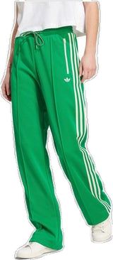 Casual Adidas Bottoms, Adidas Green Bottoms For Streetwear, Spring Sports Sweatpants With Three Stripes, Green Sportswear Bottoms With Three Stripes, Casual Green Bottoms With Three Stripes, Adidas Casual Sweatpants For Sports, Spring Casual Sweatpants With Three Stripes, Casual Sports Pants With Three Stripes Branding, Casual Spring Sweatpants With Three Stripes