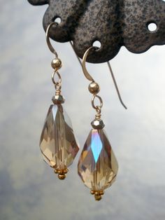 Featuring brightly faceted Austrian glass crystal teardrops in the pale beige, slightly iridescent tones of a summer evening. These versatile earrings dangle strikingly from gold-filled French ear wires and measure 1 and 1/4 inches in length. Suitable for sensitive skin, with silicone earring backs included. Gift-packaged and ready for giving or wearing! With warm thanks, Deanna Ross Owner and Designer, Spirit Arts Jewelry Handmade in Monterey, California since 1999 Elegant Drop Crystal Earrings With Faceted Beads, Pearl Teardrop Earrings, Drop Earrings Simple, Pale Beige, Crystal Teardrop Earrings, Monterey California, Jasper Earrings, Coin Earrings, Swarovski Crystal Beads