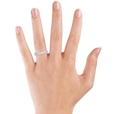 a woman's hand with a diamond ring on her left hand and the middle finger