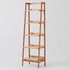 a wooden shelf with three shelves on each side