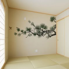 an empty room with a tree painted on the wall