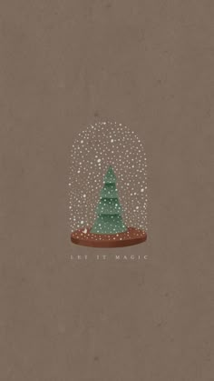 a snow globe with a christmas tree in it and the words let it magic written underneath