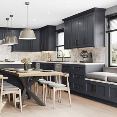 a kitchen with dark blue cabinets and wood flooring, along with a dining table surrounded by gray chairs