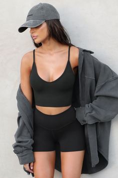 Spaghetti strap cropped tank with a u-neckline. Our FlexRib fabric was designed with comfort in mind. It's soft, stretchy and made to move with you. You'll want to wear it all day, everyday. Color: ﻿Vintage Black FlexRib Sizing: X/S (0-2), S/M (4-6), M/L (8-10) Model is 5'8" and wearing size X/S Fabric: 90% Rayon, 10% Spandex Care: Machine Wash Cold With Like Colors. Care: Lay Flat to Dry. Made in Los Angeles Form Fitting Tops, Workout Inspo, All Day Everyday, Color Vintage, Gym Wear, Crop Tank, Vintage Black, Lay Flat, Spaghetti Strap