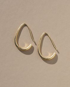 Sleek & stylish, these delicate open hoop earrings are based on a pair of hoop earrings from ancient Persia which are over 2,000 years old. They originate from Susa, one of the oldest cities in the world. Artifacts discovered at the site with the earrings include carved cylinder seals, jewelry, beads, clay balls an