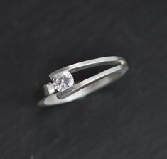 Hey, I found this really awesome Etsy listing at https://www.etsy.com/listing/569812935/tension-set-4mm-moissanite-in-sterling Modern Solitaire Stackable Rings For Promise, Modern Solitaire Stackable Rings As Promise Ring, Modern Wedding Ring With Tension Setting, Modern Single Diamond Stackable Rings For Formal Events, Modern Diamond Stackable Rings With Tension Setting, Modern Sterling Silver Ring With Single Diamond, Modern Stackable Rings With Brilliant Cut For Promise, Modern Stackable Diamond Rings With Tension Setting, Modern Stackable Rings With Single Diamond