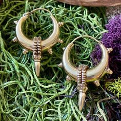 Elevate your style with our Handcrafted Statement Tribal Brass Hoop Earrings, a striking blend of bold design and cultural influence. Meticulously handcrafted, these earrings capture the essence of tribal aesthetics, making them a powerful accessory for those who appreciate unique, statement pieces. Material: High quality brass. Width- 1 /4 inches   Length - 2 inches. 🔶🌟 **Key Features - **Artisanal Craftsmanship Each pair is expertly crafted, ensuring intricate detailing and a one-of-a-kind design. - **Statement Tribal Design The bold brass hoops draw inspiration from tribal motifs, making these earrings a standout accessory. - **Versatile Statement Piece Whether for everyday wear or special occasions, these earrings make a powerful style statement. - **Secure Closure The well-designed Bohemian Metal Plug Earrings With Ear Wire, Bohemian Nickel-free Earrings For Festivals, Bohemian Jewelry For Ceremonial Festival, Bohemian Festival Jewelry For Ceremonial Occasions, Bohemian Brass Hoop Earrings, Bohemian Plug Earrings For Festivals, Bronze Bohemian Dangle Plug Earrings, Bohemian Bronze Dangle Plug Earrings, Handmade Bohemian Drop Plug Earrings