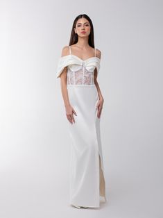 This meticulously tailored glamorous maxi dress is bolstered by its sheer lace exposed corsetry with flower embroidery, enhanced by internal boning, and its curve-hugging construction masterfully applied by Tia's artisan team.  Crafted from a luxurious satin fabric, it is accentuated by a sweetheart neckline, complemented by structured shoulder drape details for a touch of sophistication. Slim adjustable straps and an invisible zip at the back ensure a sleek, seamless appearance.  Complement thi White Satin Overbust Corset Dress, Luxury White Satin Corset Dress, White Corset With Sheer Fitted Bodice, White Satin Corset, Luxury White Lace Bodice Corset, Dad Jewelry, Lace Corset, Stocking Fillers For Her, Satin Maxi