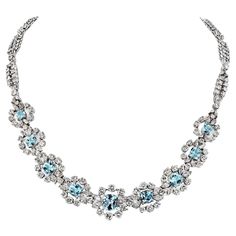 Elevate your style with this luxurious aquamarine and diamond necklace, perfect for your most special occasions. The light blue aquamarine stones, with their translucency and glossiness, create a dazzling interplay of light. This piece exudes a breathtaking and beachy charm, making you the center of attention. Crafted in 18K white gold, the necklace features a harmonious blend of round and marquise-cut diamonds, adding a touch of brilliance to its overall allure. With a length of 16 inches, it gracefully enhances your neckline, ensuring you stand out with every wear. Enjoy the admiration that comes with this stunning accessory. Diamond Weight: approx. 35.00cttw Luxury Aquamarine Necklace In Fine Jewelry Style, Luxury Aquamarine Necklaces With Diamond Accents, Light Blue Aquamarine Necklace Fine Jewelry, Luxury Aquamarine Fine Jewelry Necklace, Luxury Aquamarine Pendant Jewelry, Marquise Cut Diamond, Aquamarine Jewelry, Aquamarine Stone, Charm Making