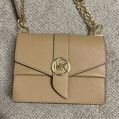 Brand New Michael Kors Small Greenwich Crossbody In Color Camel. It's The Perfect Tan Nude Neutral Basic Color. This Style Still Retails At Full Price For $300 On The Mk Website. Can Be Worn As A Crossbody And Shoulder Bag. No Flaws Michael Kors Beige Top Handle Shoulder Bag, Beige Flap Bag With Gold-tone Hardware, Beige Shoulder Flap Bag With Branded Hardware, Michael Kors Beige Crossbody Bag, Beige Flap Shoulder Bag With Branded Hardware, Michael Kors Beige Bag With Detachable Strap, Michael Kors Beige Crossbody Shoulder Bag, Michael Kors Beige Satchel With Removable Pouch, Michael Kors Beige Shoulder Bag For Formal Occasions