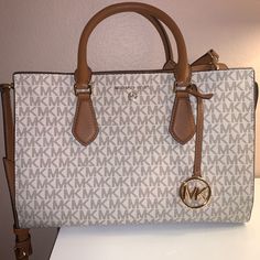 - Medium Purse - Nude Brown/White - Authentic - Still New Michael Kors Beige Satchel With Detachable Handle, Michael Kors Beige Rectangular Satchel, Beige Michael Kors Satchel With Dust Bag, Michael Kors Cream Bag With Detachable Handle, Michael Kors Beige Bag With Detachable Strap, Neutral Satchel With Gold-tone Hardware, Michael Kors Neutral Shopping Bag, Michael Kors Beige Bag For On-the-go, Michael Kors Neutral Bag For Shopping