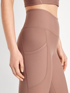 elasticized waistband hip pockets go-dry wicks moisture sits at belly button fitted hip and thigh hits mid-calf 21" regular inseam 19" petite inseam 24" tall inseam models are approx.  5'9" and wear sizes s (4), l (12), and xl (18)machine wash according to the care instruction label Stretch Mid-thigh Bottoms With Pockets, Stretch Bottoms With Pockets, Mid-thigh Length, Fitted Bottoms With Pockets Mid-thigh Length, Fitted Mid-thigh Length Bottoms With Pockets, High Waist Leggings With Built-in Shorts, Athleisure Solid Yoga Pants With Hip Pockets, Functional Compressive Bottoms With Hip Pockets, Solid Yoga Pants With Contoured Waistband And 5-inch Inseam, Mid-thigh Length Bottoms For Pilates