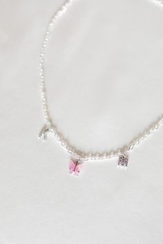 "A dainty personalized necklace featuring a colorful butterfly charm in between two crystal initials. Choose from peachy pink, turquoise blue, fuchsia pink, yellow, lavender, white, emerald green, ruby red, royal blue, jet black, and charcoal. Matching earrings: https://www.etsy.com/listing/693774042/colored-mariposa-butterfly-earrings-18k ✧ 1 gold plated necklace ✧ chain: 4mm curb (picture 2 & 5) or 3mm rolo (picture 1 & 4) ✧ lobster clasp closure ✧ nickel + lead free ✧ length: 16\"/40. Mariposa Butterfly, Delicate Choker, Turquoise Rose, Colorful Butterfly, Bleu Turquoise, Gold Initial, Custom Initials, Valentine's Gift, Butterfly Charm