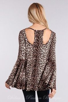 Solo La Fe Extra wide bell sleeves top, cut out neckline front and back. Soft jersey fabric. Extra long sleeves.Color: Animal Print Sizes S-M-L Bust 34-36-38, Length 26, our model is 5' 3" and wearing small 95% Rayon, 5% Spandex, Jersey, Made in USA B4/TD3280A Stretch Long Sleeve Blouse For Brunch, Fall Long Sleeve Top For Brunch, Chic Leopard Print Long Sleeve Tops, Chic Long Sleeve Leopard Print Top, Long Sleeve Tops For Brunch, Long Sleeve Stretch Tops For Brunch, Stretch Long Sleeve Tops For Brunch, Fall Stretch Tops With Bell Sleeves, Stretch Bell Sleeve Tops For Fall