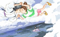 two people are flying in the air over the ocean and one is holding onto another person's head