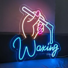 Enhance the ambiance of your waxing studio or beauty salon with this stylish Waxing Neon Sign. Designed to create a welcoming and professional atmosphere, this neon sign is perfect for esthetician salons, spa rooms, and beauty spaces focused on waxing and skincare. The bright glow and sleek design make it a standout piece, instantly elevating your salon's decor while signaling your waxing services. 🌟Easy to plug Plug your sign into a normal outlet and your neon sign is ready to shine. We provid Waxing Studio Ideas, Wax Room Setup, Wax Room Ideas Estheticians, Wax Room Ideas, Wax Room Decor, Waxing Logo, Salon Room Decor, Waxing Aesthetic, Esthetics Salon