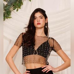 Sophisticated Short Sleeve Mesh Crop Top With Pearl Beading And Rhinestone Embellishes. Top Features A Round Neck With A Semi-Fitted Style. Fabric Contains Stretch And Can Be Easily Pulled Over Head. Versatile In Style And Suitable For Most Occasions. Pair Top With A Cami Underneath For A Professional Setting Or Off To The Parties With A Sexy Bralette. Elegant Sheer Crop Top For Evening, Elegant Sheer Evening Crop Top, Fitted Crystal Embellished Crop Top For Evening, Embellished Crop Top For Evening Parties, Embellished Evening Crop Top For Party Season, Embellished Crop Top For Evening Party Season, Glamorous Embellished Tops For Party Season, Glamorous Sparkling Tops For Evening, Glamorous Sparkling Evening Tops